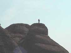 Brave person on top of the rocks at Meteora